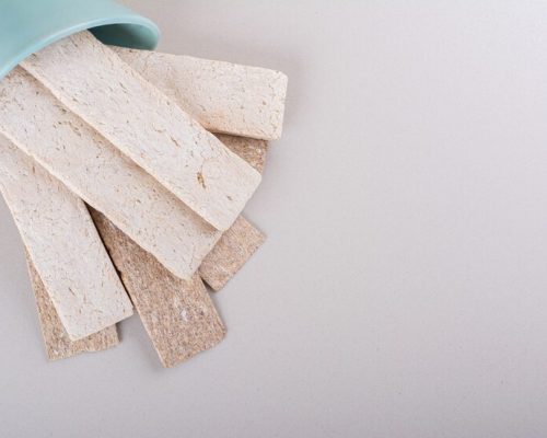 crispy-waffles-out-blue-bowl-white-table-high-quality-photo_114579-75770